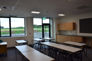 A classroom overlooking a field